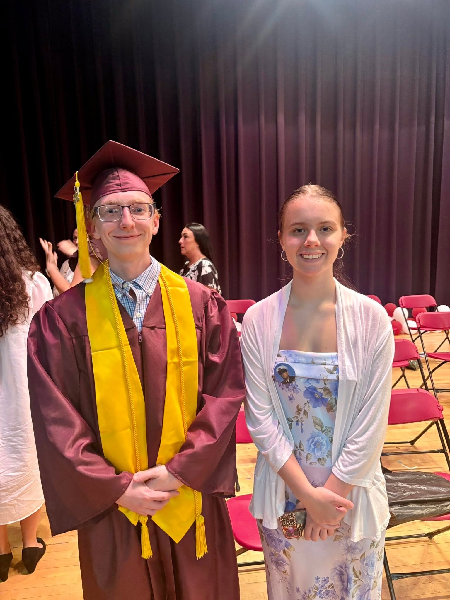 Scholarship award ceremony — graduate and family